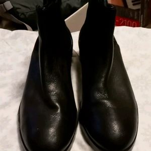 Cole Haan ankle boots.